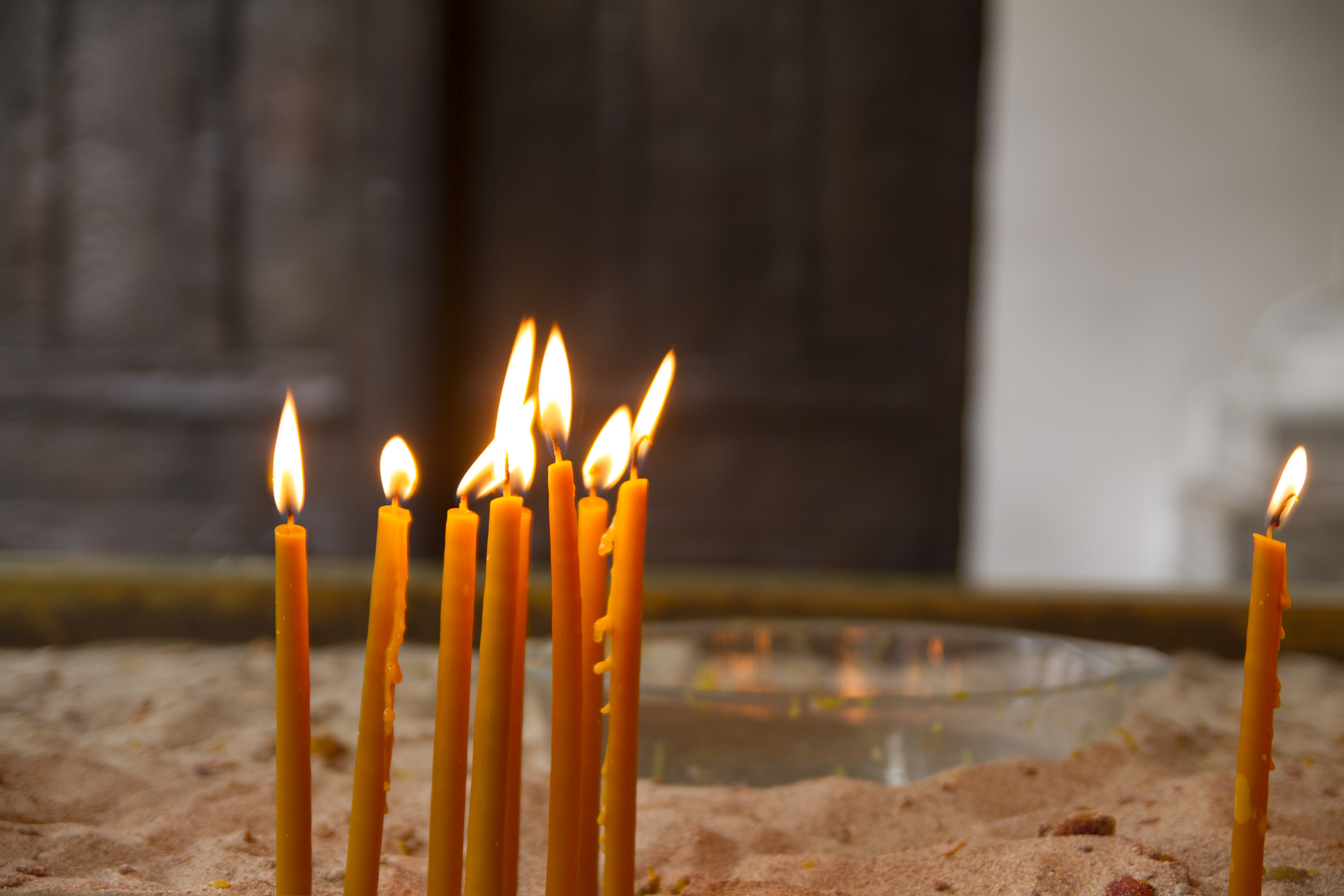 Few candles burning in the church.